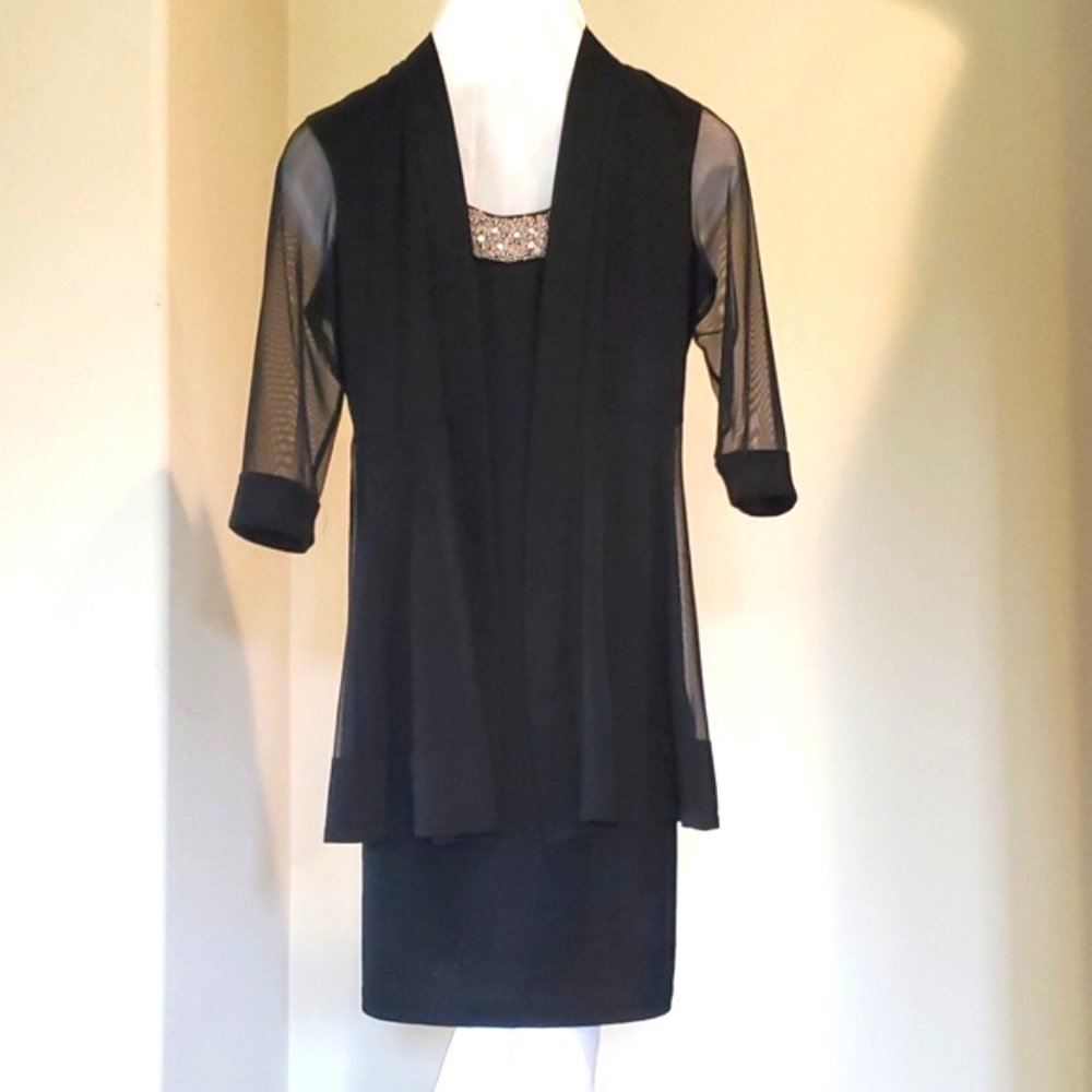 ❤️  Little black dress with matching sheer jacket.